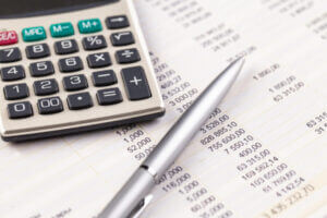 tracking your money for a budget with calculator and spread sheets