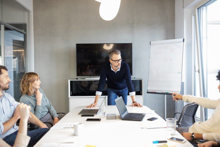 Business people in a board room meeting