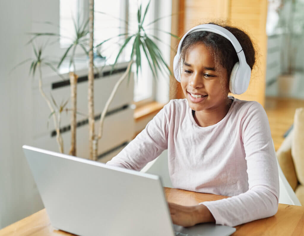 youth learning the basics of finances on her computer