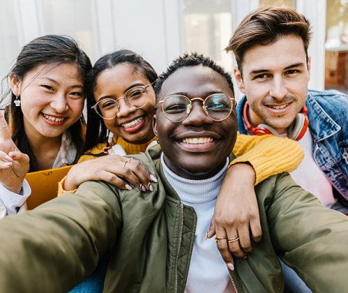 Self portrait of multiracial group of young student friends Columbia Credit Union Accessibility Statement - Usability for all.